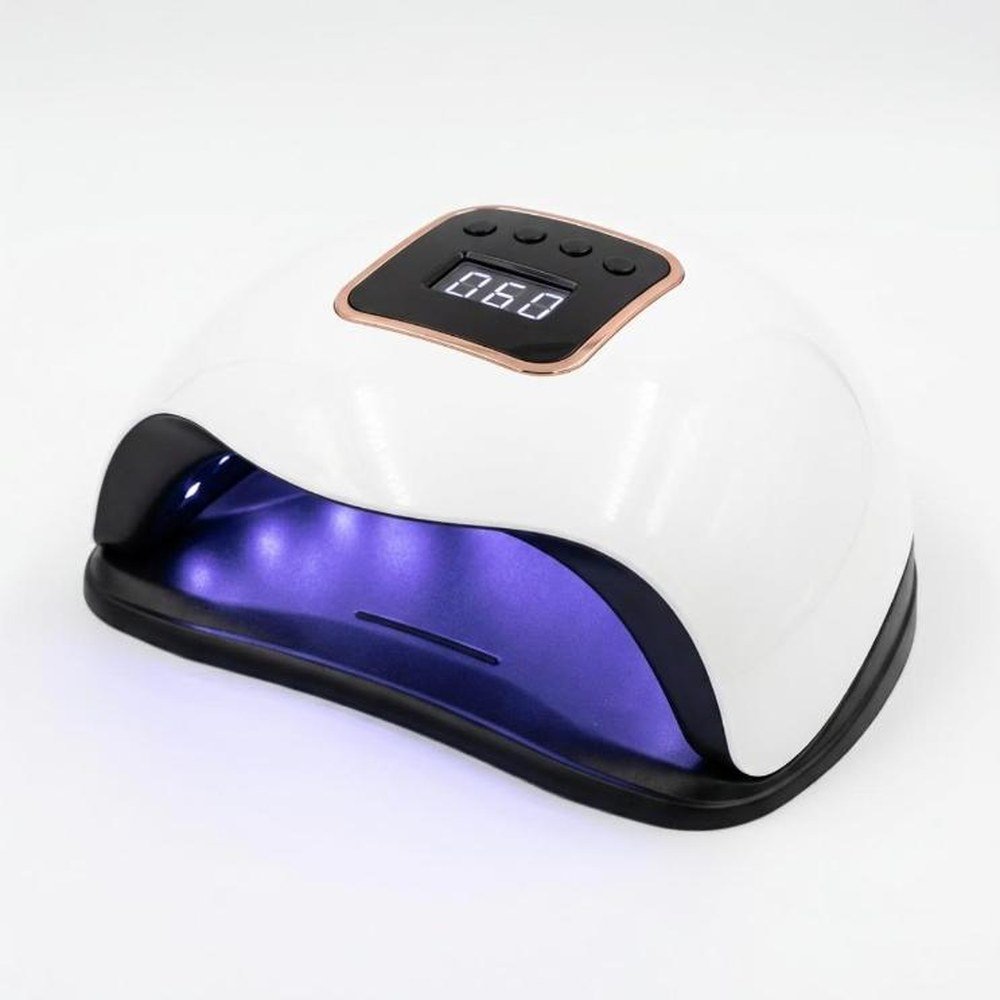 Lampe UV LED pour ongles, coque blanche et socle noir, écran et quatre boutons sur le dessus, allumée en violet